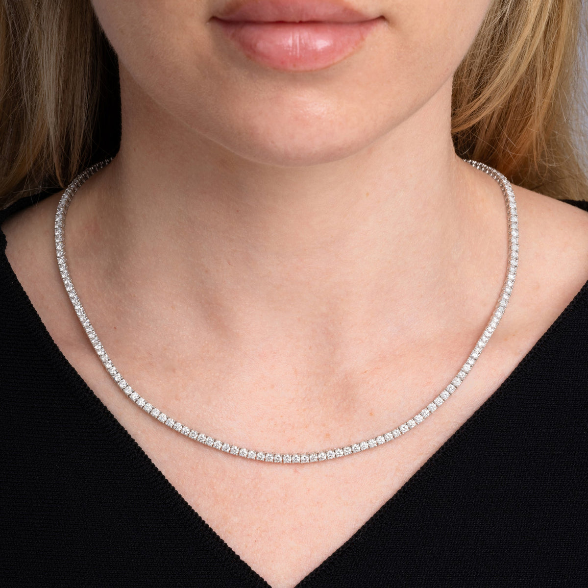 10.85 carat round diamond tennis necklace worn at the collarbone