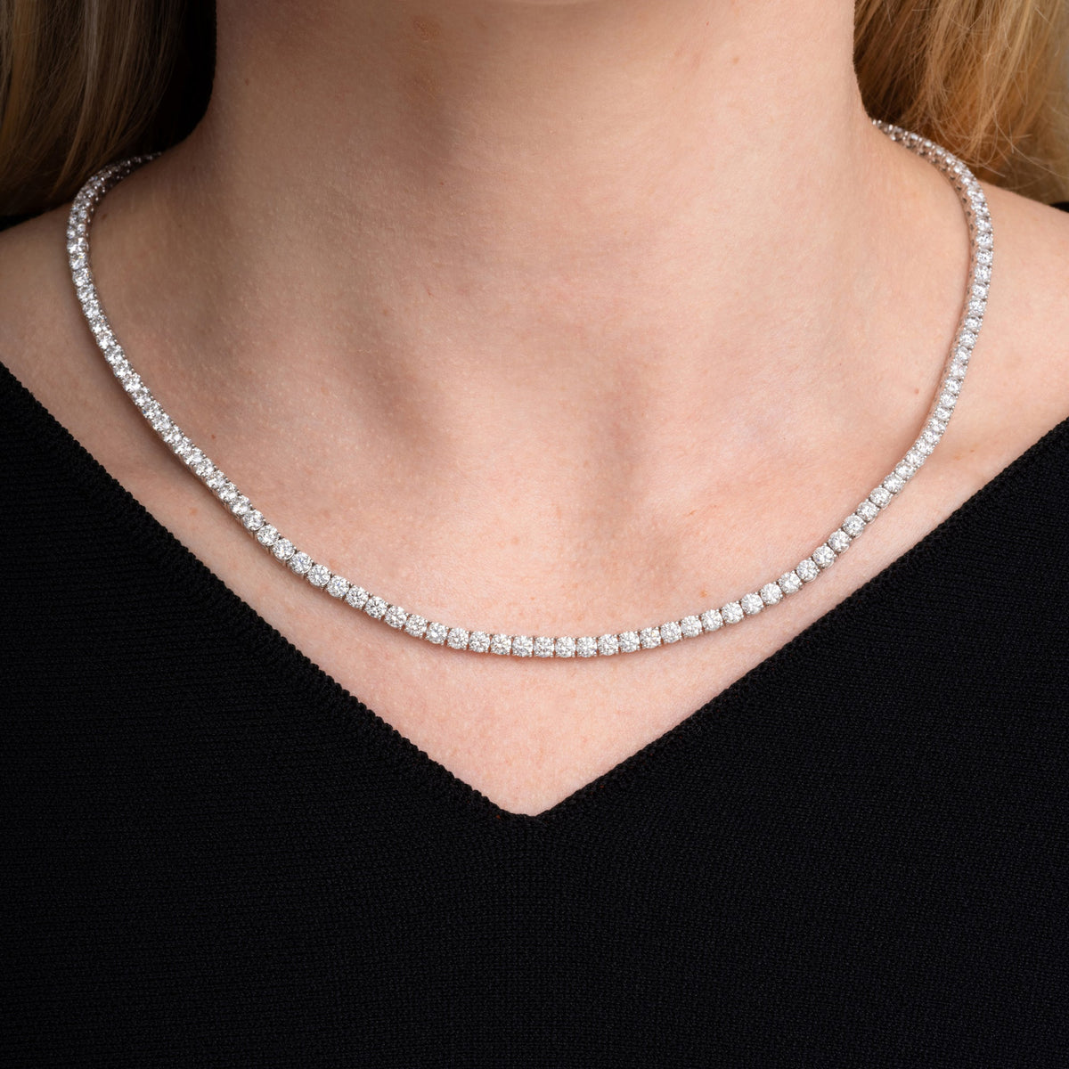 19.01 carat round diamond tennis necklace worn at the collarbone