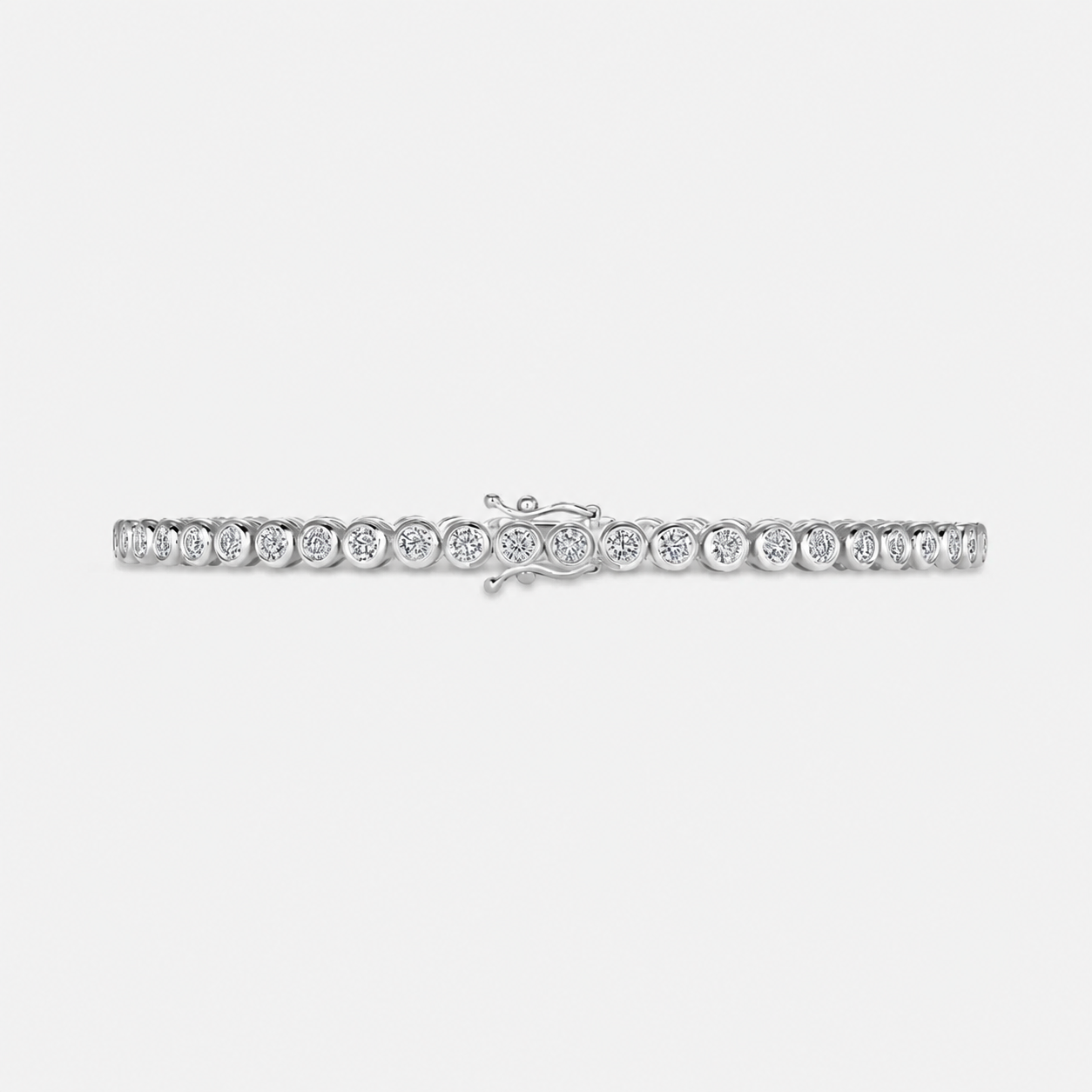 Bezel set lab grown diamond tennis bracelet in 14K white gold, laid flat with the box clasp visible #Metal_White Gold