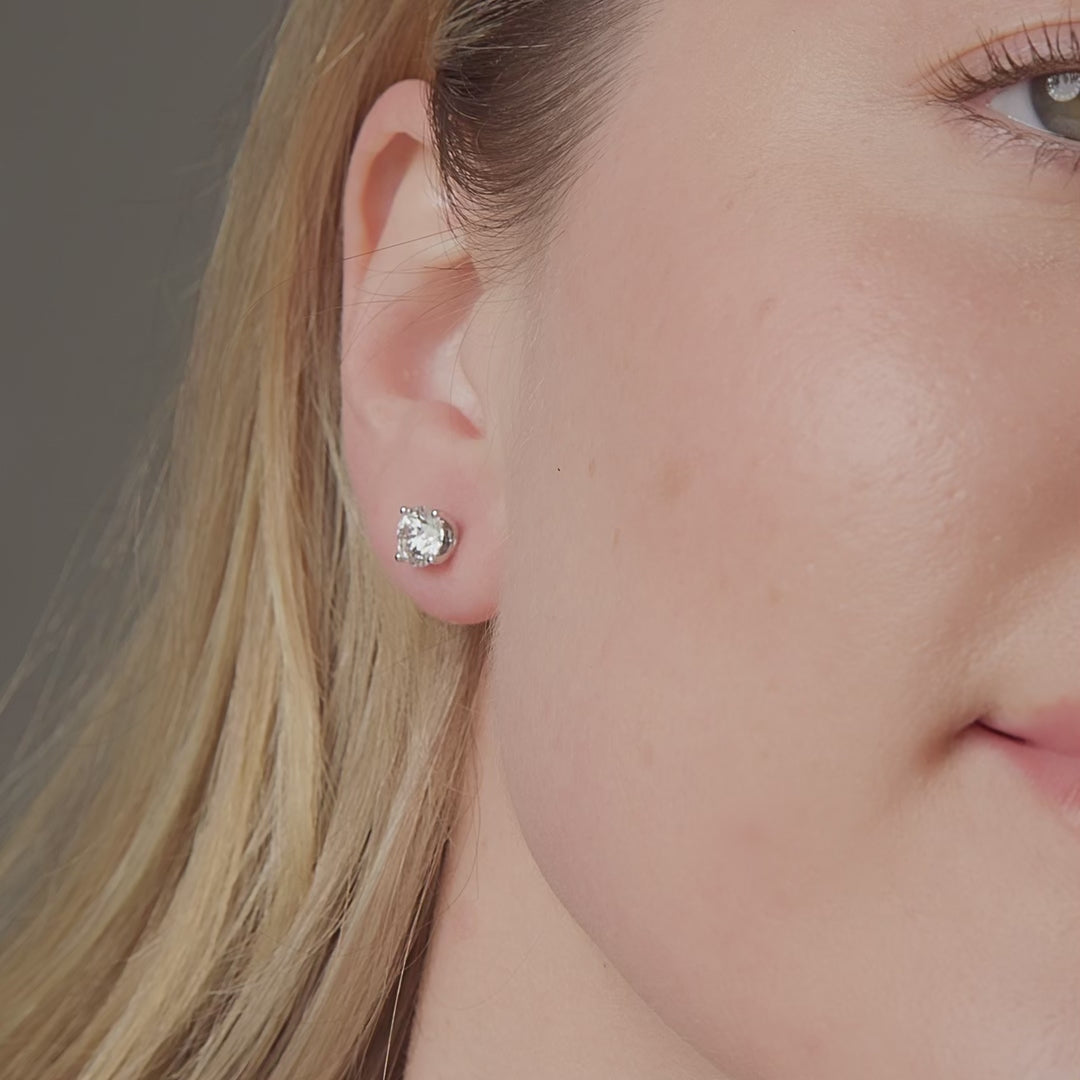 Rosette round diamond stud earrings, 2.12 carats total weight, E colour VS1 clarity
