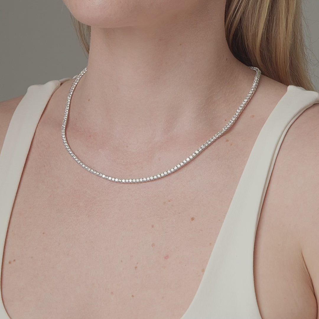 10.85 carat round diamond tennis necklace shown in motion on the neck