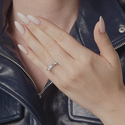 Round diamond eternity band shown in motion on the hand, 5.22 carat total weight