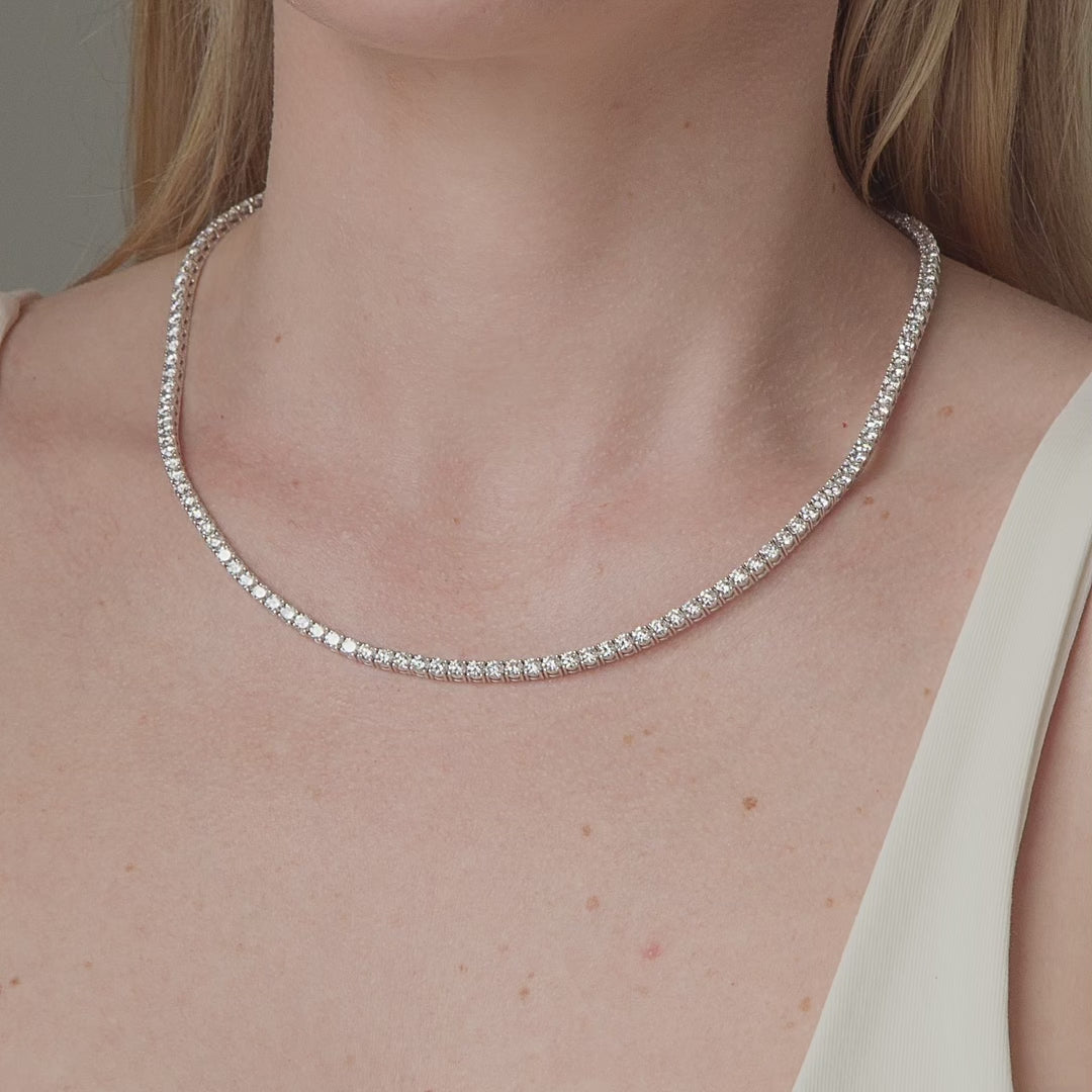 19.01 carat round diamond tennis necklace shown in motion on the neck