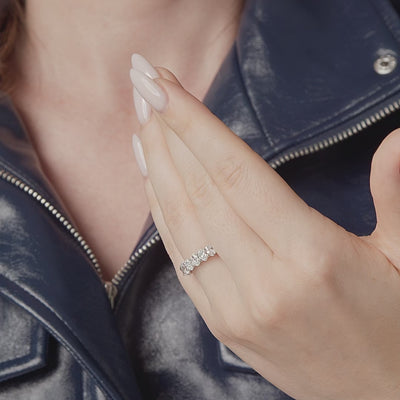 Oval lab grown diamond eternity band shown in motion on the hand