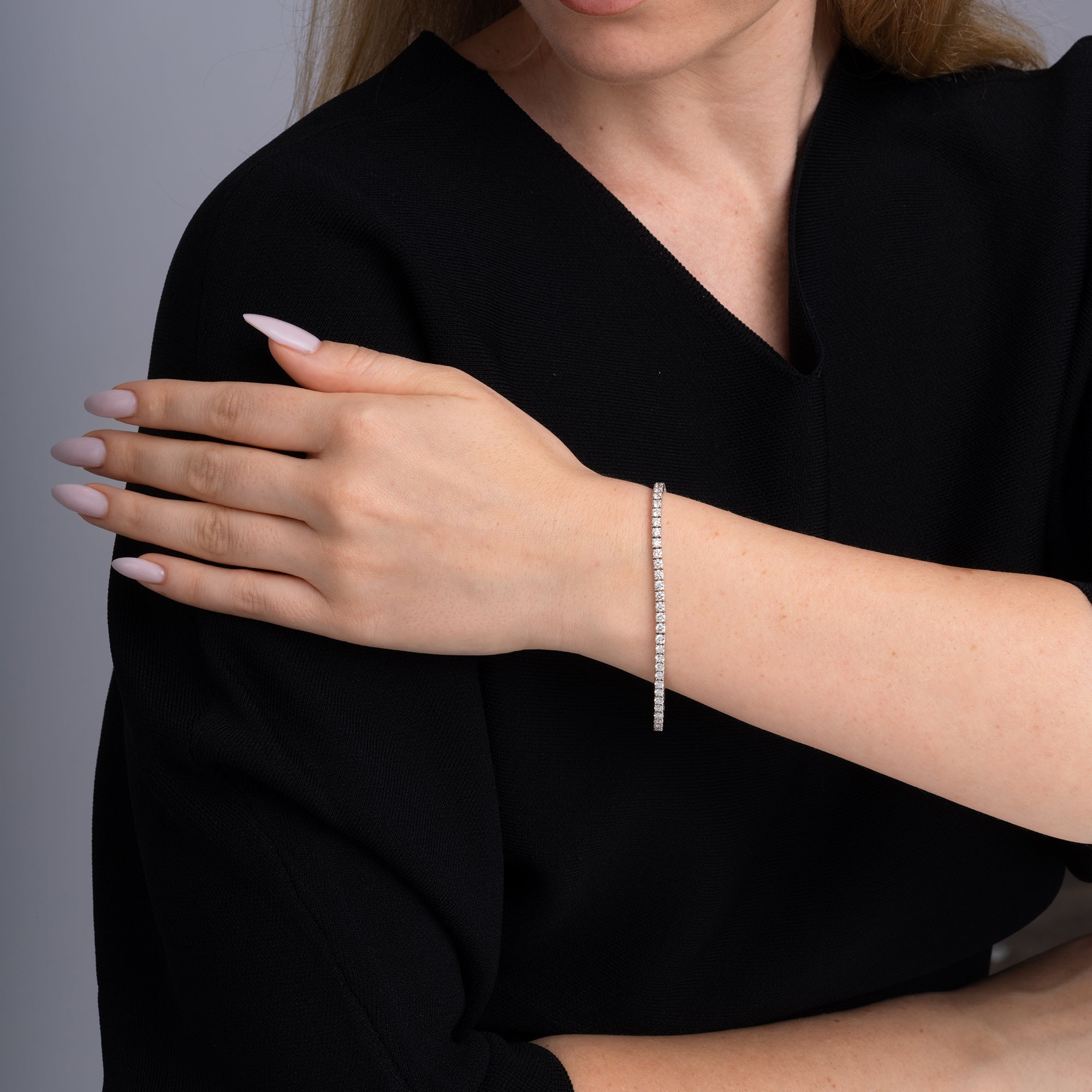 5.30 carat round diamond tennis bracelet worn on the wrist