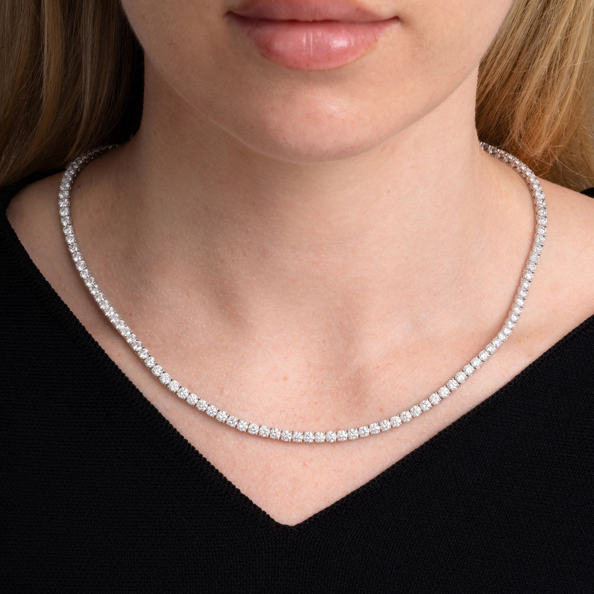 19.01 carat round diamond tennis necklace worn at the collarbone