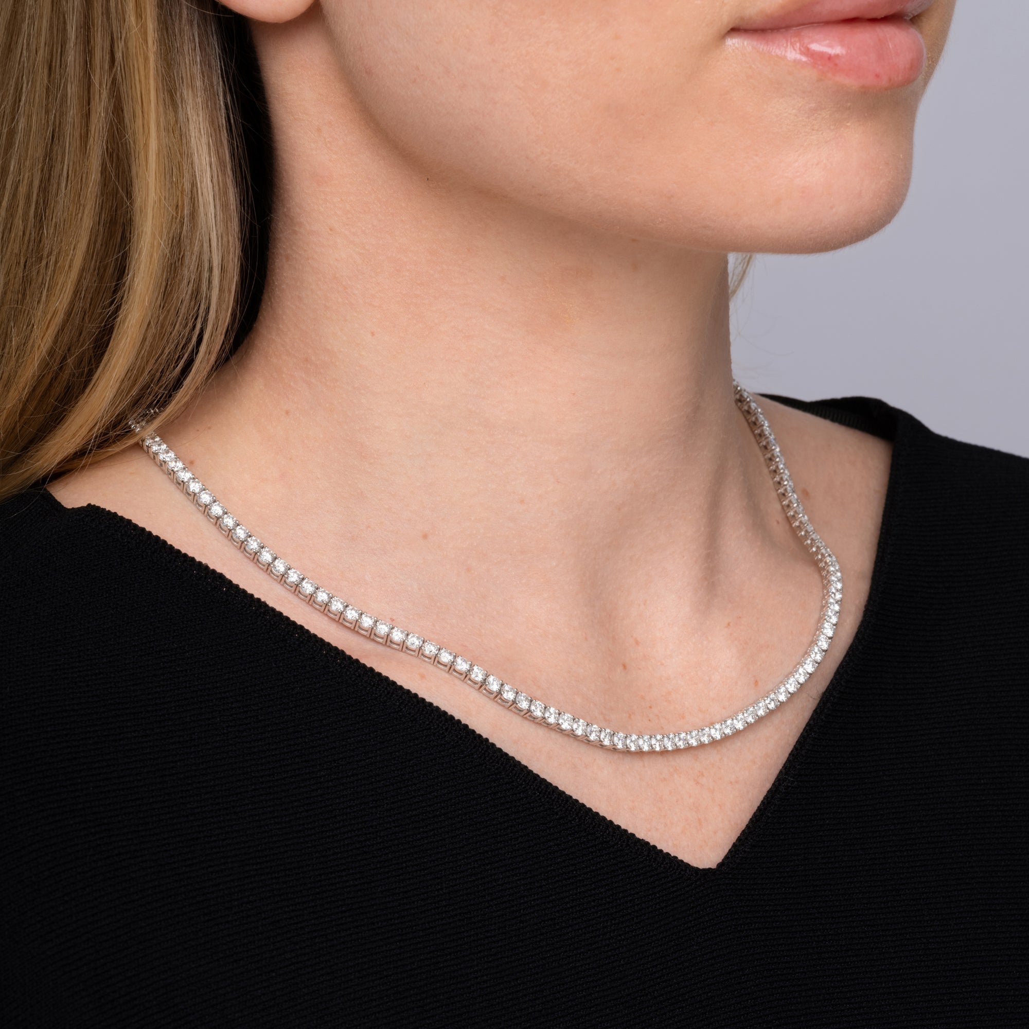 19.01 carat round diamond tennis necklace worn at the collarbone