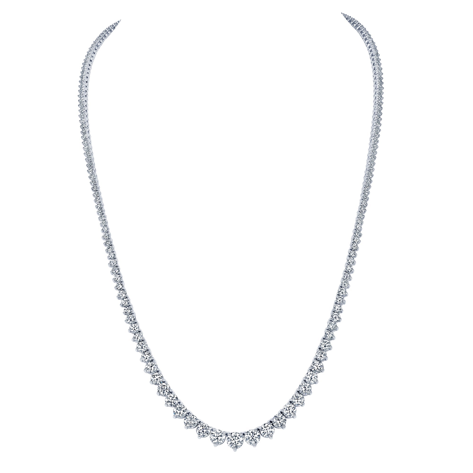 Graduated diamond tennis necklace detail showing stones increasing in size toward the center