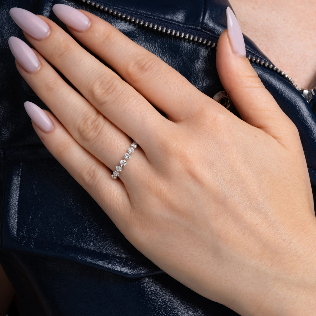 Half eternity band styled on the hand in 14K gold
